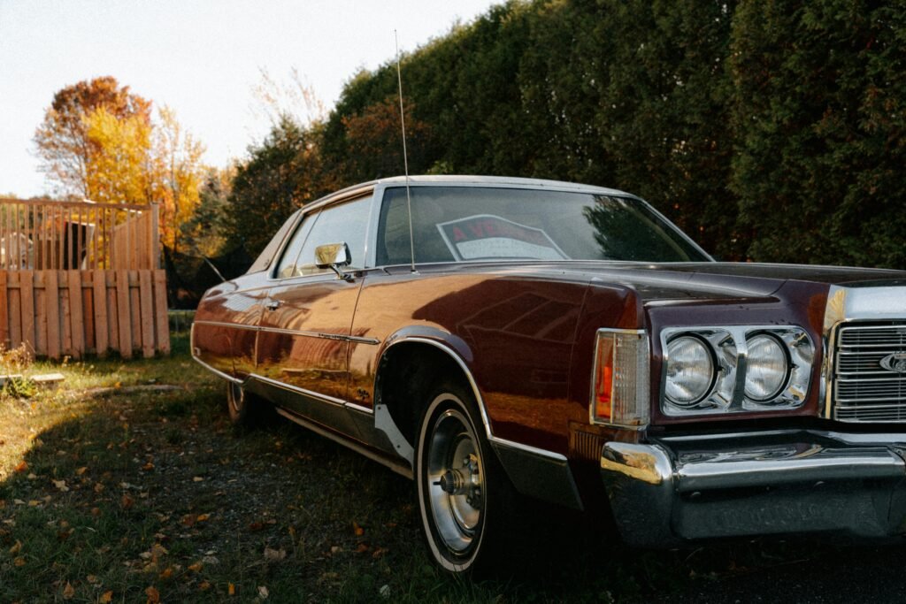pexels-photo-34298365-34298365 Elegant vintage car parked outdoors in autumn North Hatley, Quebec.